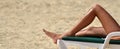 Woman sunbathing and relaxing on tanning bed