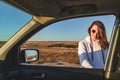 woman in sunglasses opening car door Royalty Free Stock Photo