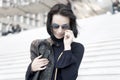Woman in sunglasses on stairs, Parisian woman Royalty Free Stock Photo