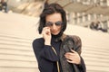 Woman in sunglasses on stairs, Parisian woman Royalty Free Stock Photo