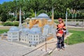 Woman in sunglasses standing near the small Hagia Sophia mosque in the Istanbul park of miniature