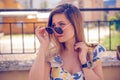 woman with sunglasses wearing trendy summer clothes outside Royalty Free Stock Photo