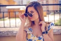woman with sunglasses wearing trendy summer clothes outside Royalty Free Stock Photo