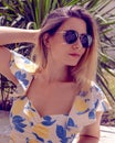 woman with sunglasses wearing trendy summer clothes outside Royalty Free Stock Photo