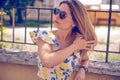 woman with sunglasses wearing trendy summer clothes outside Royalty Free Stock Photo