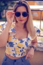 woman with sunglasses wearing trendy summer clothes outside Royalty Free Stock Photo