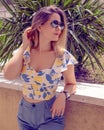 woman with sunglasses wearing trendy summer clothes outside Royalty Free Stock Photo