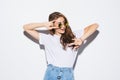 Woman with sunglasses in a white T-shirt on a white background. Royalty Free Stock Photo