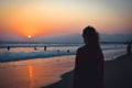 Woman at sunset at the beach or ocean. Summer landscape California. Santa Monica Beach