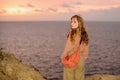 Woman on sunset. Beautiful girl on beach. Summertime. Carefree. Beach at sunset outdoors. Royalty Free Stock Photo