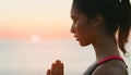 Woman, sunset and yoga meditation for spiritual balance, healthcare or wellness in outdoor. Prayer hands, ocean and Royalty Free Stock Photo