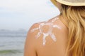 Woman with suntan lotion at the beach Royalty Free Stock Photo