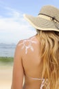 Woman with suntan lotion at the beach Royalty Free Stock Photo