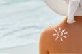 Woman With Suntan Lotion At The Beach In Form Of The Sun. Portrait Of Female With the Drawn Sun On a Shoulder Royalty Free Stock Photo
