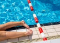 Woman suntbathing at edge of swiming pool Royalty Free Stock Photo