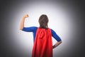 Woman superhero with red cape, isolated.