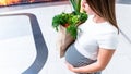 Woman supermarket grocery food bag. Pregnancy mother with healthy vegetables, fresh lettuce salad leaves in market food Royalty Free Stock Photo