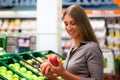 Woman in supermarket shopping groceries Royalty Free Stock Photo