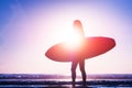 Woman with surfboard