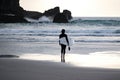 Woman surfer in black wetsuit Royalty Free Stock Photo