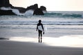 Woman surfer in black wetsuit Royalty Free Stock Photo