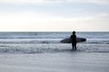 Woman surfer in black wetsuit Royalty Free Stock Photo