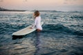 Woman surfer with board in hands at the beach Royalty Free Stock Photo