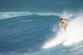 Woman surfer enjoys riding waves