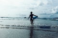 Woman surfer with surfboard Royalty Free Stock Photo