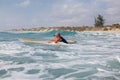 Woman surfer swimming in sea Royalty Free Stock Photo