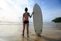 Woman surfer with white surfboard Royalty Free Stock Photo