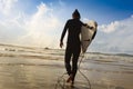 Woman surfer with white surfboard on a beach Royalty Free Stock Photo