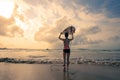 Woman surfer with white surfboard walking to the sea Royalty Free Stock Photo