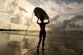 Woman surfer with white surfboard walking to the sea Royalty Free Stock Photo