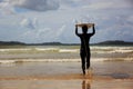 Woman surfer with white surfboard walking Royalty Free Stock Photo