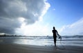 Woman surfer with white surfboard walking Royalty Free Stock Photo