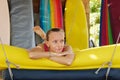 Woman on surfing beach relaxes while lying on couch. Royalty Free Stock Photo