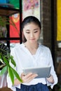 Woman surfing the net in coffee shop Royalty Free Stock Photo