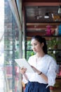 Woman surfing the net in coffee shop Royalty Free Stock Photo