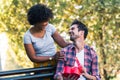 Woman Surprises man With Gift in the park Royalty Free Stock Photo