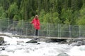 Woman on suspension bridge