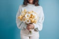 woman sweater flower romantic blue white yellow bouquet floral hold hand. Generative AI. Royalty Free Stock Photo