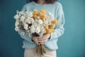 woman blue romantic yellow floral white flower sweater hand anniversary bouquet. Generative AI. Royalty Free Stock Photo