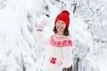 Woman in sweater playing snow ball fight in winter Royalty Free Stock Photo