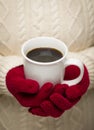 Woman in Sweater with Red Mittens Holding Cup of Coffee Royalty Free Stock Photo