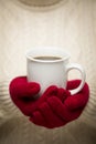 Woman in Sweater with Red Mittens Holding Cup of Coffee Royalty Free Stock Photo