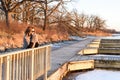 Woman standing on wooden bridge in winter Royalty Free Stock Photo