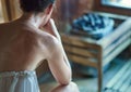 Woman sweating in finnish sauna Royalty Free Stock Photo