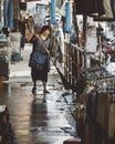 Woman sweeping at warorot market, Chinatown in Chiang Mai