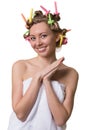 Woman with a sweet face and curlers on hair.